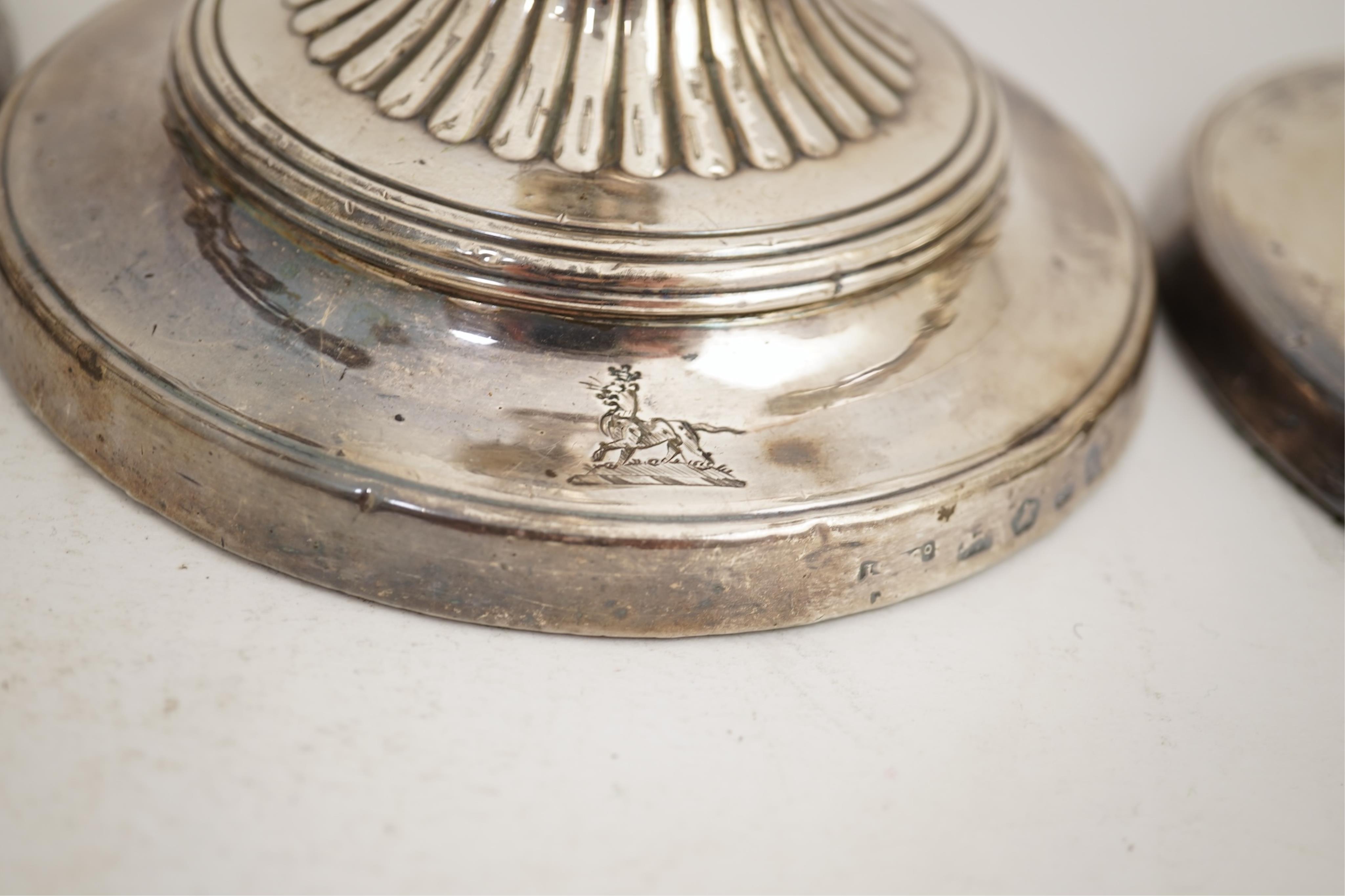 A set of four George III silver candlesticks by John Green, Roberts, Mosley & Co
